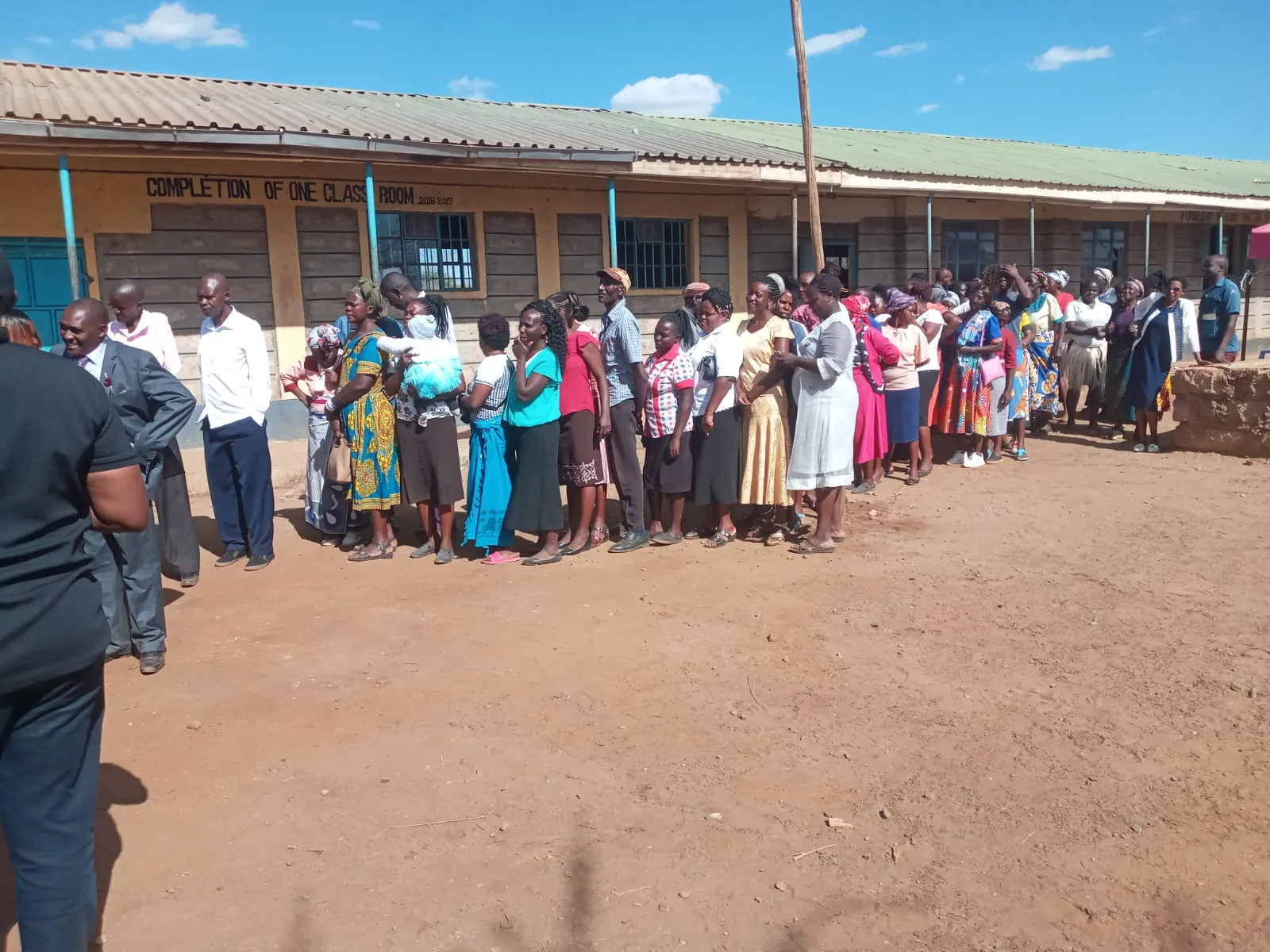 A broad school gathering reflects the community around Ndalani.