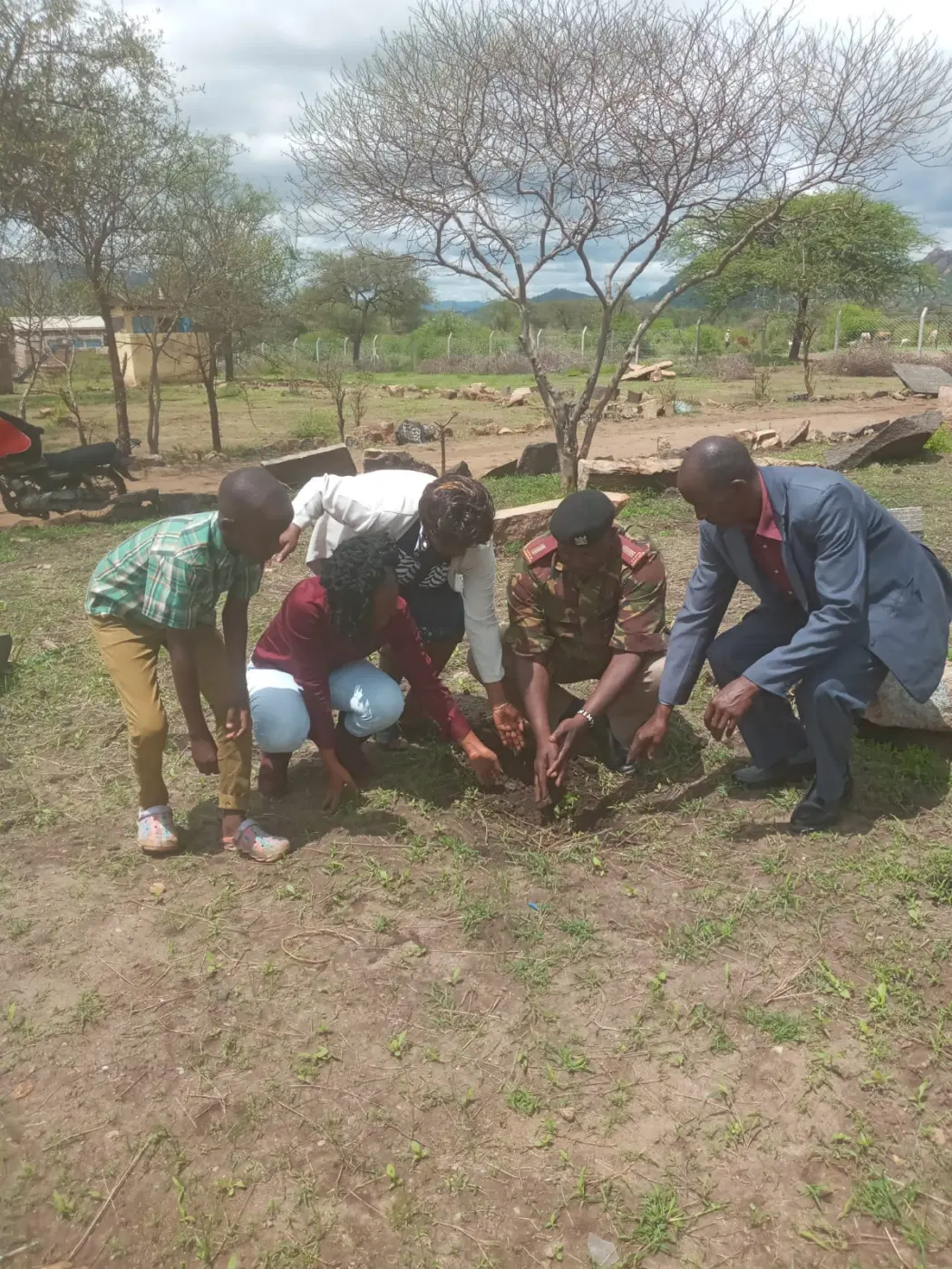 Alumni and community members take part in the planting exercise.