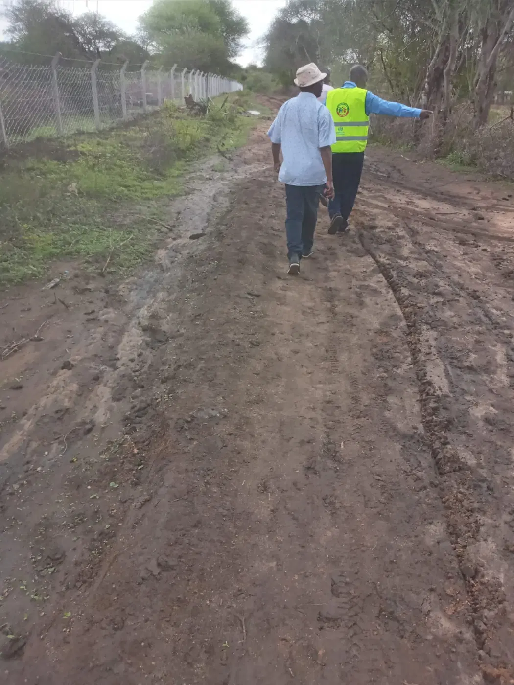 Checking the fence line around the school compound.