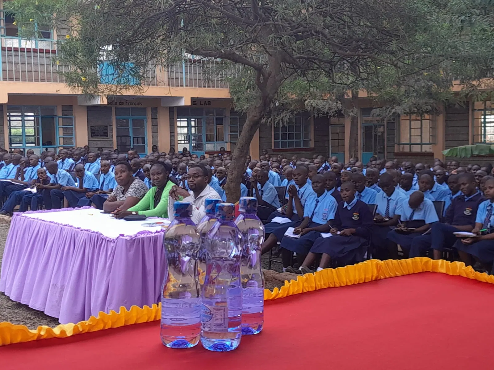 Students gather in the school courtyard for the talk.